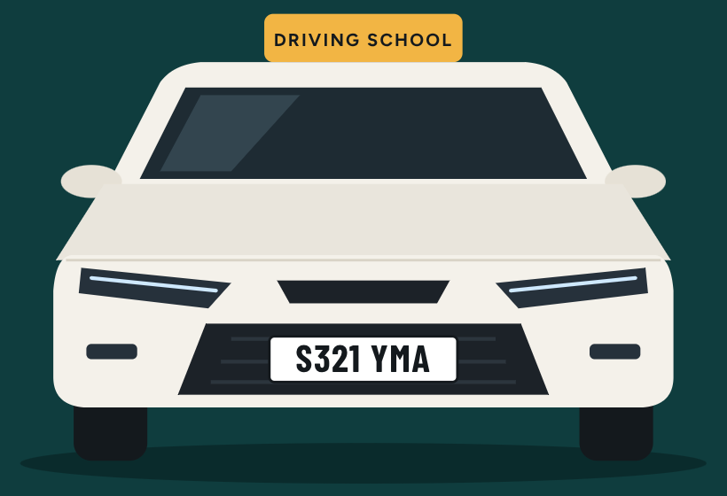 A white driving school car with a roof sign